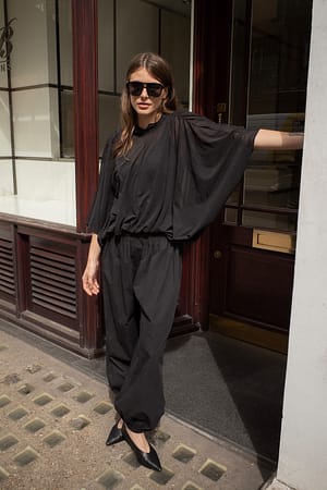 Black Top transparente con dobladillo de burbujas
