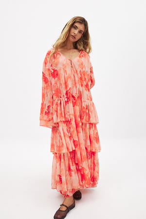 Långärmad kaftan i chiffong med volang