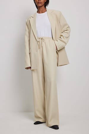 Beige Klassiska byxor med elastisk midja