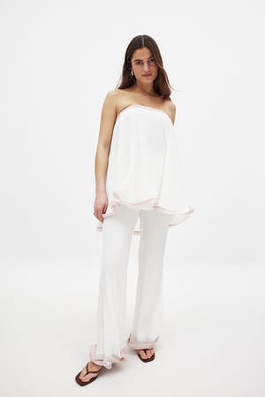 White Pantalón plisado con volantes