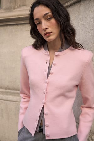Pink Strickjacke mit Schulterpolstern