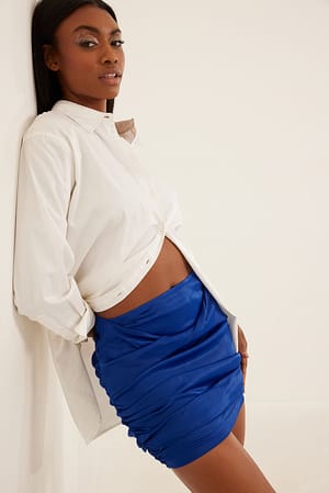 Blue Mini rok met gedrapeerde voorkant