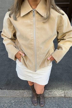 Beige Jakke i fuskeskinn med glidelås
