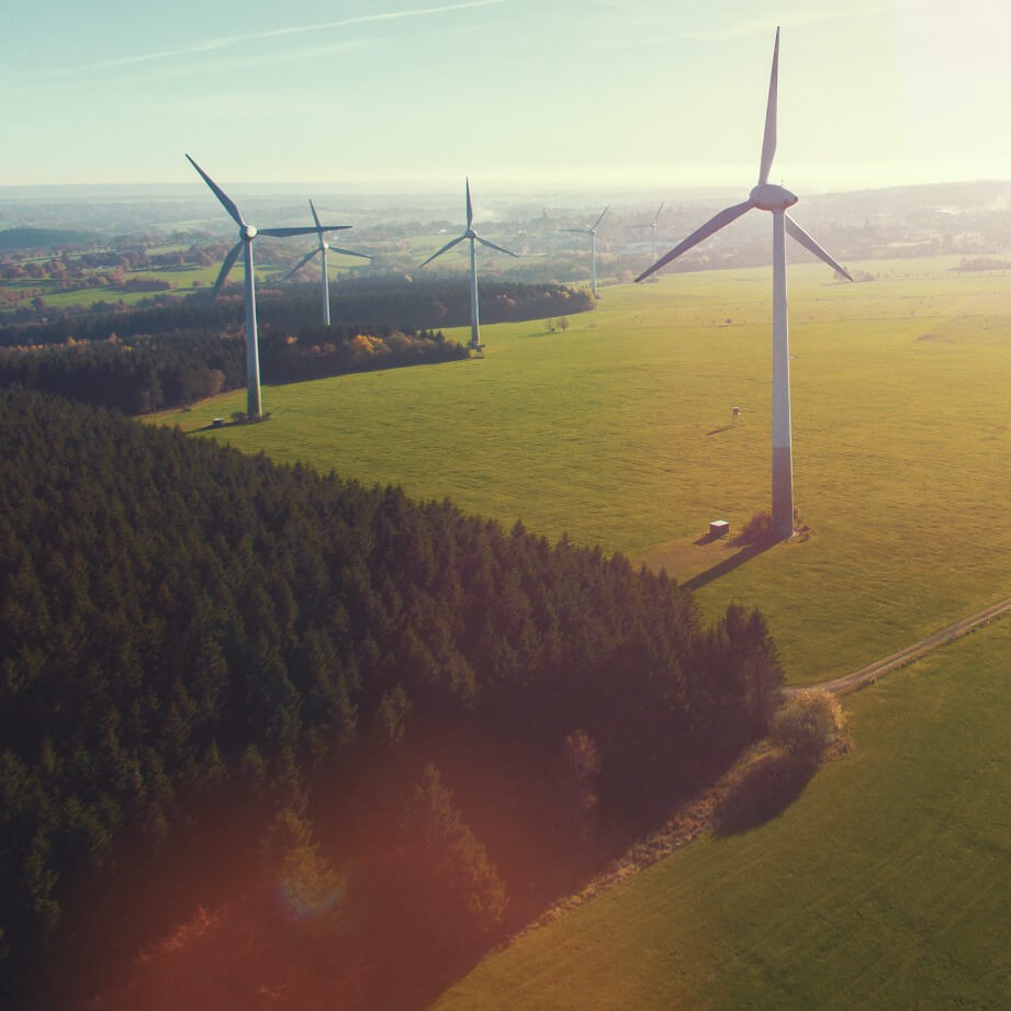 Aerial shot of wind turbines at dusk