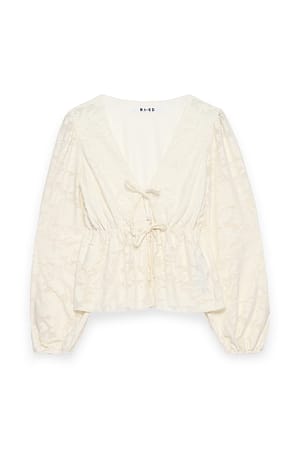 Offwhite Burn out-topp med puffärmar