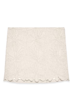Beige Minirock aus Leinenmischung mit Broderie-Anglaise-Detail
