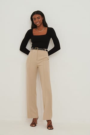 Beige Strakke pantalon met wijde pijpen