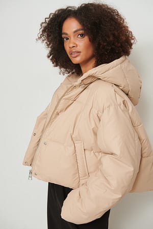 Light Beige Veste matelassée enduite à capuche