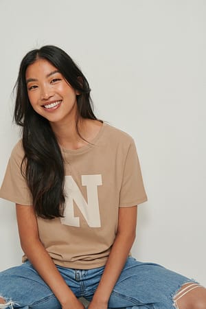 Beige T-shirt met print