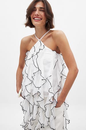 Off White Strukturerad topp i chiffong med volangdetalj
