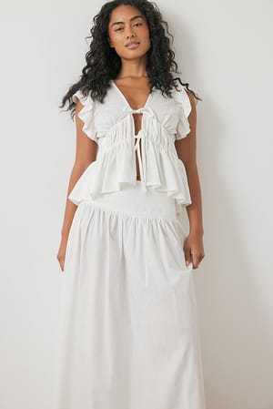 Offwhite Top con volantes en los hombros