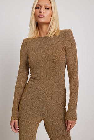Gold Glitter catsuit met schoudervulling