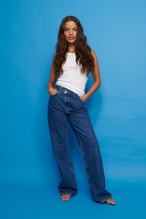 Mid Blue Organische jeans met wijde pijpen en asymmetrische sluiting