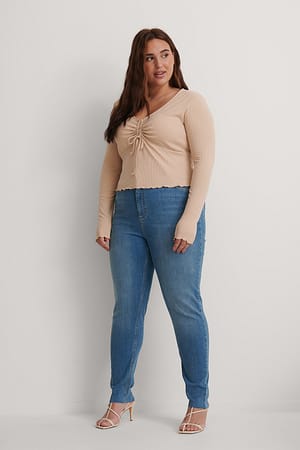 Mid Blue Organische Skinny Jeans mit hoher Taille und rohem Saum