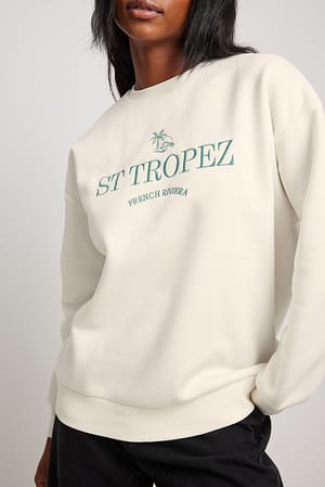 Offwhite Sweatshirt mit Aufdruck St. Tropez City