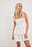Bandeau-minikjole i broderie anglaise med flæser