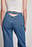 Denim med öppen ryggdetalj