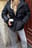 Gefütterte Jacke mit Gürtel aus recyceltem Material