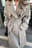 Trenchcoat med dobbelte knapper