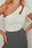 Asymmetrische top met one-shoulder