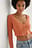 Recycled ribbstickad topp med knappdetalj