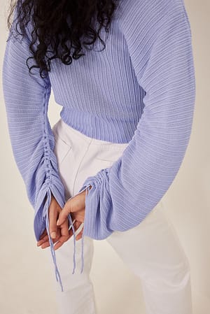 Lilac Finstrikket slå-om sweater med løbebåndsdetalje