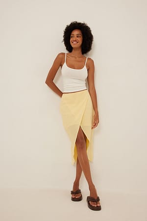 Light Yellow Falda de algodón suave de diseño superpuesto