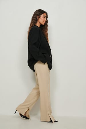 Beige Pantalones tailor fit con apertura lateral