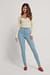 Økologiske højtaljede lange skinny jeans med rå hem