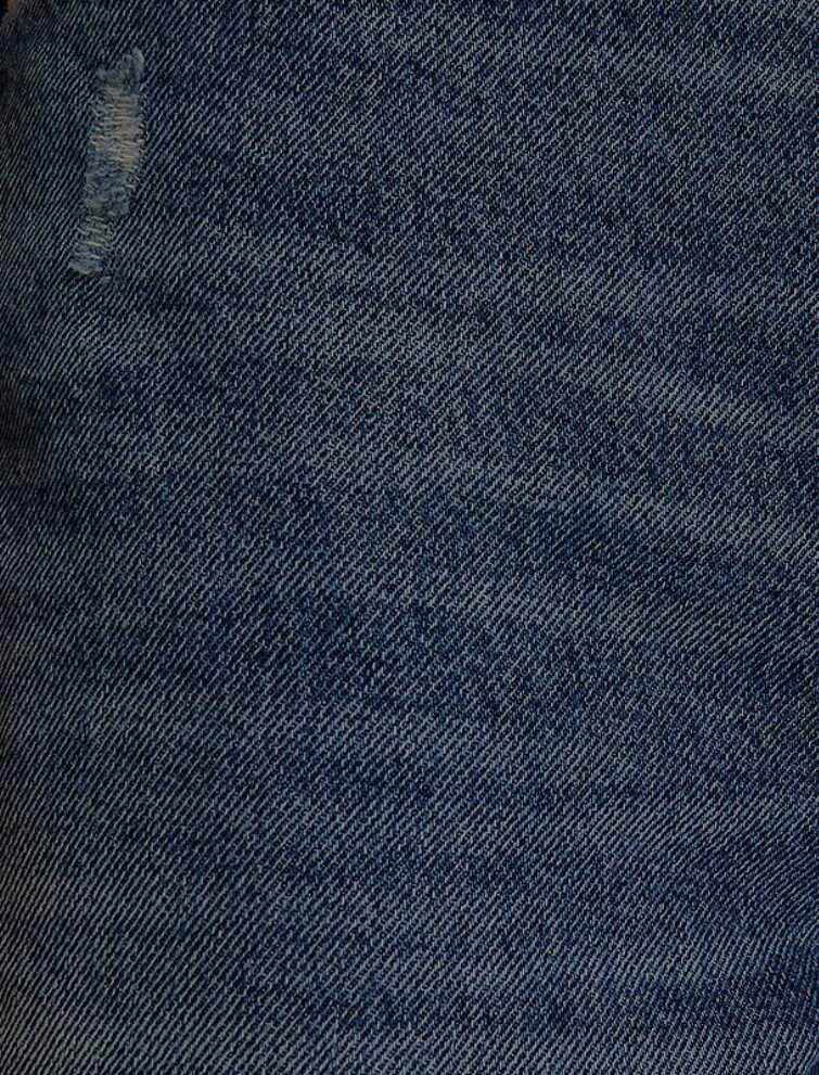 Closeup of well-worn jeans